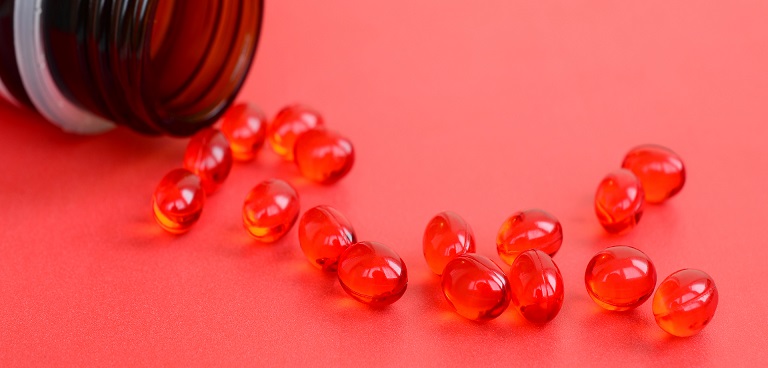 Fish oil softgels and krill oil capsules compared side by side